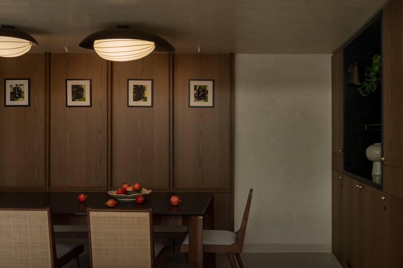 The same dining area with the ceiling lights switched on
